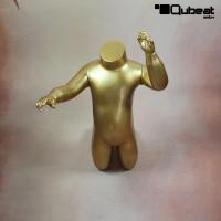 Gold kneeling window mannequin