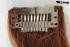 Lockige Clip-In-Extensions aus Kunsthaar in Bronze